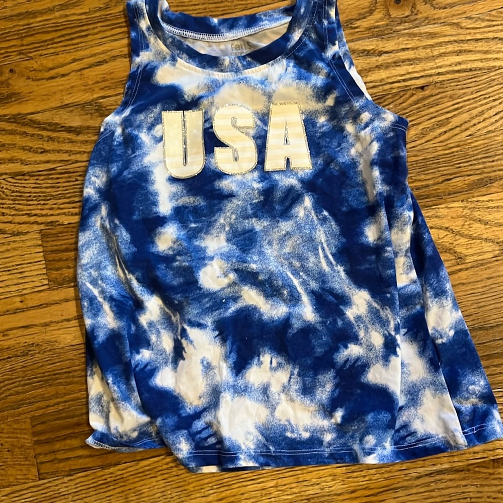 I'm selling a blue and white tank top that says USA on the front size M 7/8
